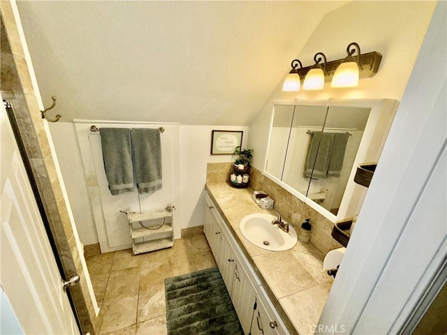9312 Mountain Meadow Rd, Shingletown, CA 96088 - full bathroom featuring lofted ceiling, vanity, a shower, and tasteful backsplash