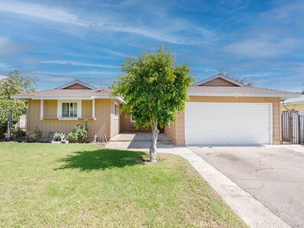 14168 Claretta St, Arleta, CA 91331 - ranch-style home with asphalt driveway, an attached garage, and a front lawn