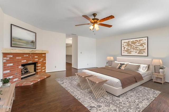 2000 Morongo Dr, Camarillo, CA 93012 - bedroom with wood finished floors, a walk in closet, a brick fireplace, and ceiling fan