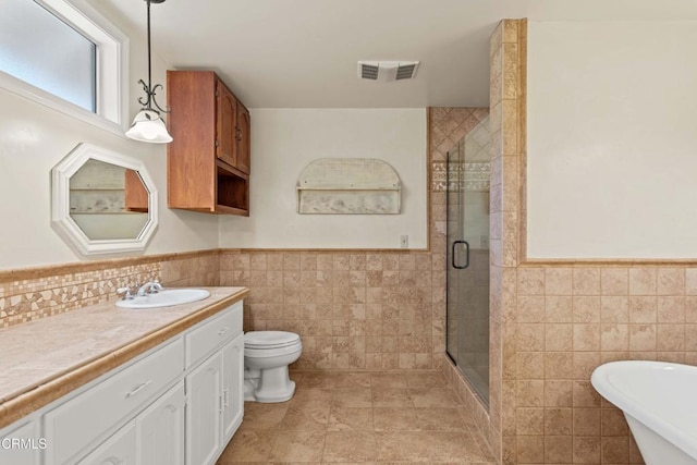 2000 Morongo Dr, Camarillo, CA 93012 - full bath with tile walls, wainscoting, vanity, a shower stall, and a freestanding bath