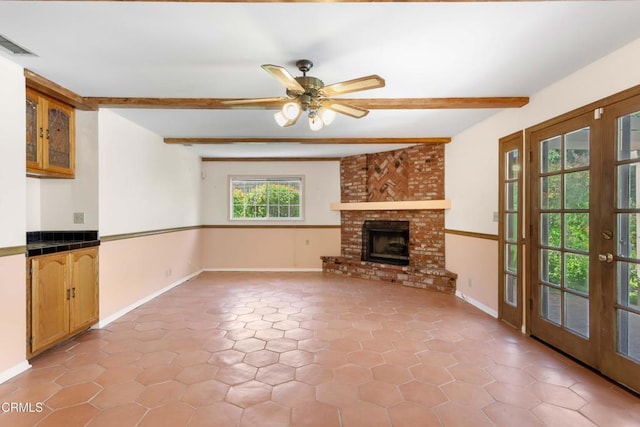 2000 Morongo Dr, Camarillo, CA 93012 - unfurnished living room with beamed ceiling, a brick fireplace, a ceiling fan, and light tile patterned flooring