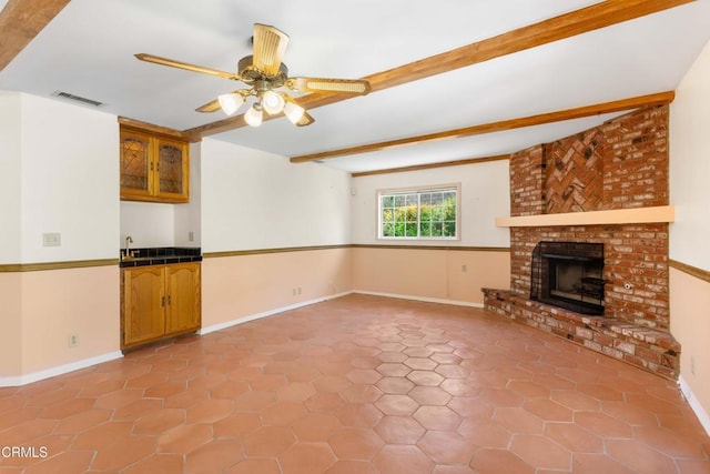 2000 Morongo Dr, Camarillo, CA 93012 - unfurnished living room featuring beam ceiling, a fireplace, ceiling fan, and light tile patterned floors