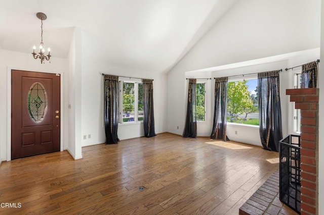 2000 Morongo Dr, Camarillo, CA 93012 - foyer entrance with a chandelier, plenty of natural light, wood-type flooring, and high vaulted ceiling