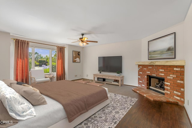 2000 Morongo Dr, Camarillo, CA 93012 - bedroom featuring wood finished floors, a brick fireplace, and a ceiling fan