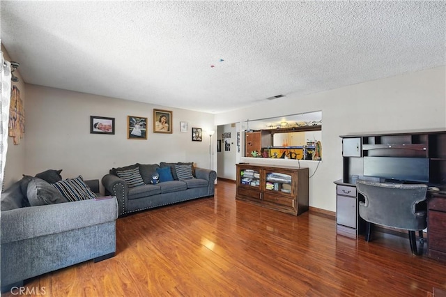 11813 Colima Rd, Whittier, CA 90604 - living room with wood finished floors, a textured ceiling, and an office area