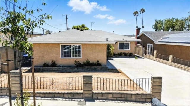 11813 Colima Rd, Whittier, CA 90604 - view of front facade with a fenced front yard, stucco siding, a gate, and a shingled roof