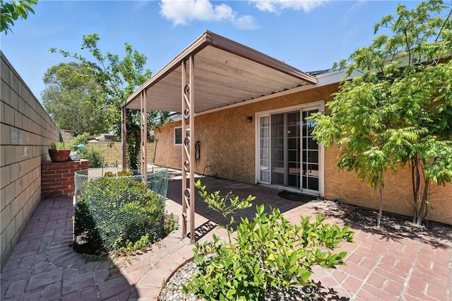 11813 Colima Rd, Whittier, CA 90604 - view of property exterior with stucco siding and a patio area