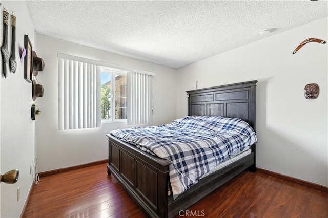 11813 Colima Rd, Whittier, CA 90604 - bedroom with a textured ceiling and dark wood-type flooring