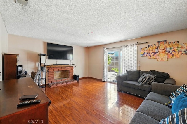 11813 Colima Rd, Whittier, CA 90604 - living room featuring a textured ceiling, wood finished floors, and a fireplace