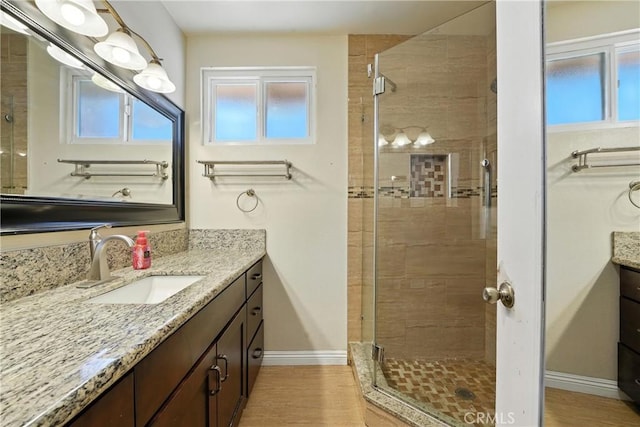 11813 Colima Rd, Whittier, CA 90604 - bathroom with vanity, a shower stall, and wood finished floors
