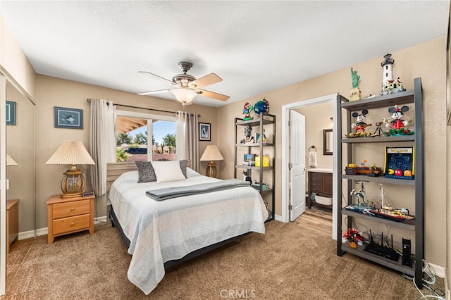 19082 Tecumseh Rd, Apple Valley, CA 92307 - carpeted bedroom featuring connected bathroom and a ceiling fan