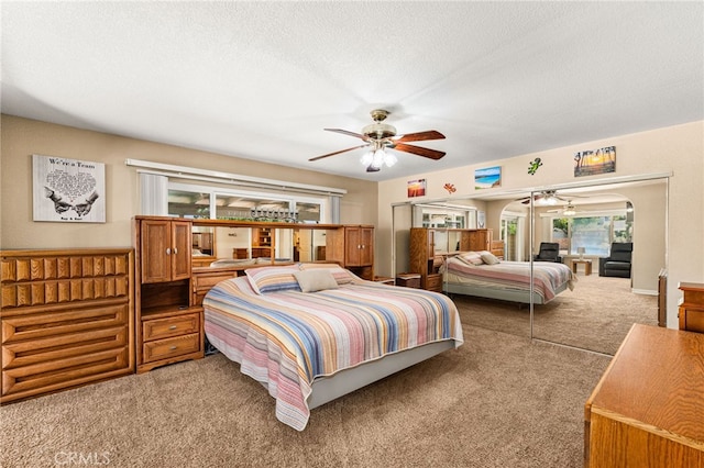 19082 Tecumseh Rd, Apple Valley, CA 92307 - carpeted bedroom with a textured ceiling and ceiling fan