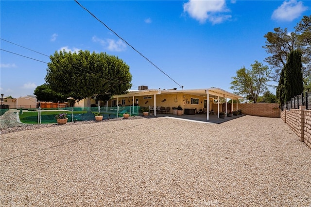 19082 Tecumseh Rd, Apple Valley, CA 92307 - rear view of house featuring a fenced backyard and a patio area