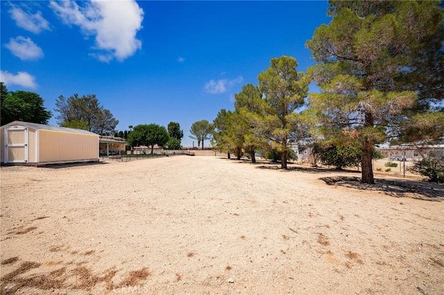 19082 Tecumseh Rd, Apple Valley, CA 92307 - view of yard featuring a storage shed
