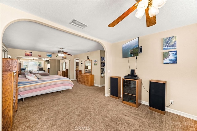19082 Tecumseh Rd, Apple Valley, CA 92307 - bedroom featuring carpet flooring, arched walkways, and ceiling fan