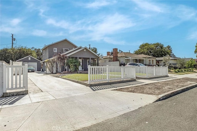 417 N Lamer St, Burbank, CA 91506 - view of front facade with a fenced front yard, concrete driveway, a garage, and stucco siding