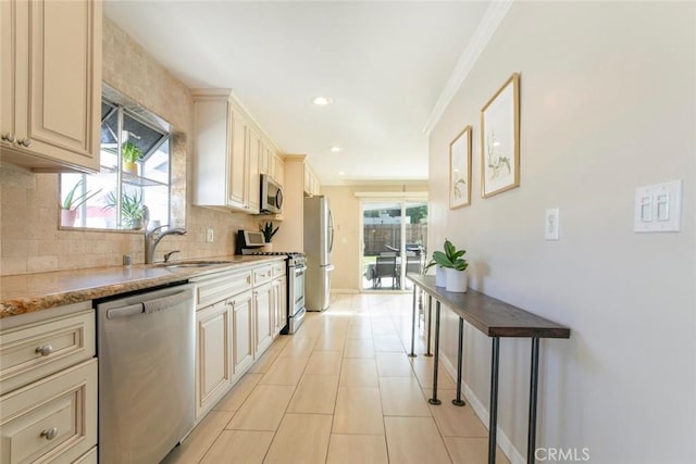 417 N Lamer St, Burbank, CA 91506 - kitchen with appliances with stainless steel finishes, ornamental molding, tasteful backsplash, cream cabinetry, and recessed lighting