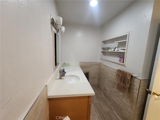8626 Laurel Canyon Blvd, Sun Valley, CA 91352 - bathroom featuring vanity and tile walls
