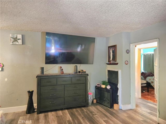 8626 Laurel Canyon Blvd, Sun Valley, CA 91352 - living room with wood finished floors and a textured ceiling