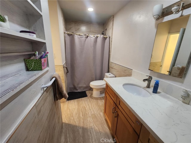 8626 Laurel Canyon Blvd, Sun Valley, CA 91352 - full bath with vanity, a shower with shower curtain, wood finished floors, and tile walls