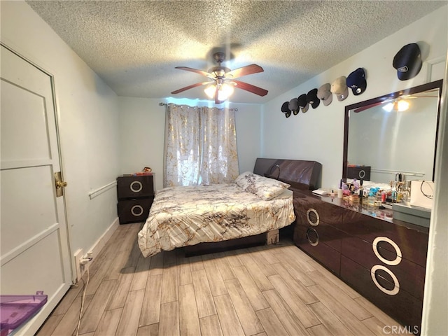 8626 Laurel Canyon Blvd, Sun Valley, CA 91352 - bedroom featuring light wood-style flooring, a textured ceiling, and ceiling fan