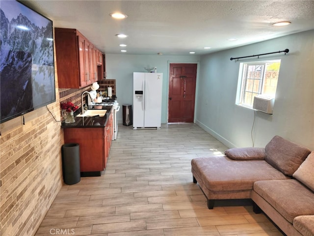 8626 Laurel Canyon Blvd, Sun Valley, CA 91352 - kitchen with white appliances, light wood-style flooring, open floor plan, dark countertops, and brown cabinetry