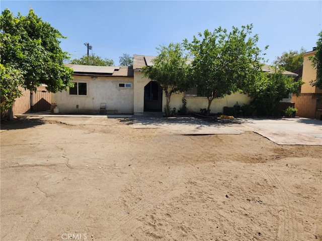 8626 Laurel Canyon Blvd, Sun Valley, CA 91352 - view of front of home featuring roof mounted solar panels and stucco siding