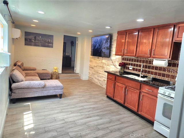 8626 Laurel Canyon Blvd, Sun Valley, CA 91352 - kitchen with gas range gas stove, open floor plan, recessed lighting, backsplash, and light wood finished floors