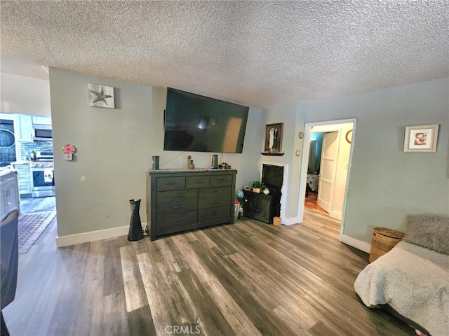 8626 Laurel Canyon Blvd, Sun Valley, CA 91352 - living room with wood finished floors and a textured ceiling