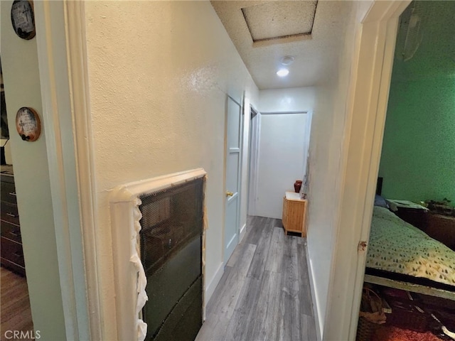 8626 Laurel Canyon Blvd, Sun Valley, CA 91352 - hall with wood finished floors and a textured ceiling