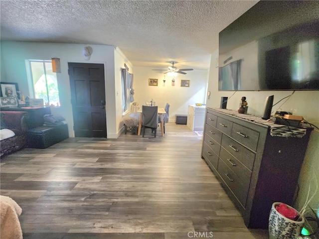 8626 Laurel Canyon Blvd, Sun Valley, CA 91352 - bedroom with wood finished floors, a textured ceiling, and ceiling fan