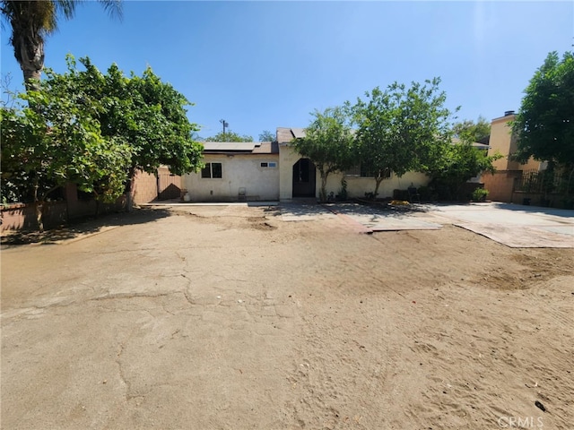 8626 Laurel Canyon Blvd, Sun Valley, CA 91352 - view of front of property featuring roof mounted solar panels and stucco siding