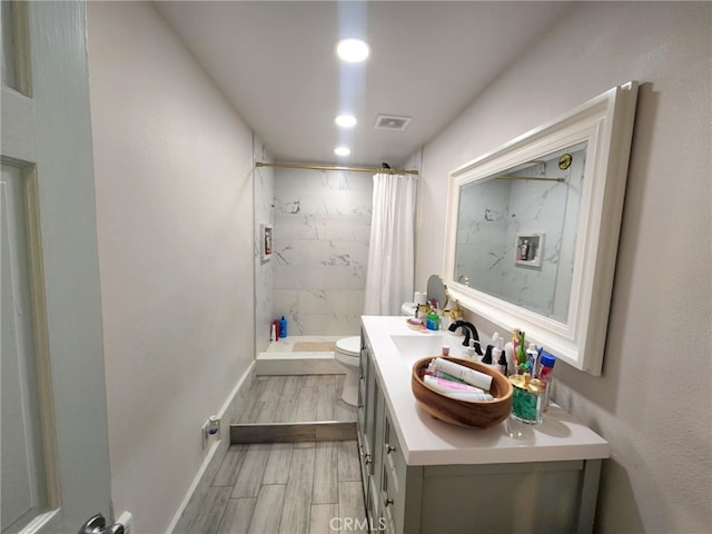 8626 Laurel Canyon Blvd, Sun Valley, CA 91352 - full bathroom with a marble finish shower, vanity, wood finished floors, and recessed lighting