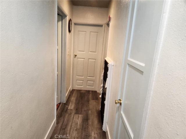 8626 Laurel Canyon Blvd, Sun Valley, CA 91352 - hall featuring dark wood-style floors and a textured wall