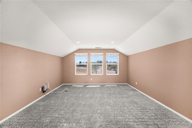 1909 Crystal Cove Ct, Redlands, CA 92374 - additional living space featuring vaulted ceiling, carpet floors, and a textured wall