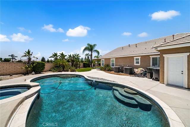 1909 Crystal Cove Ct, Redlands, CA 92374 - view of pool with a fenced backyard, a pool with connected hot tub, and a patio