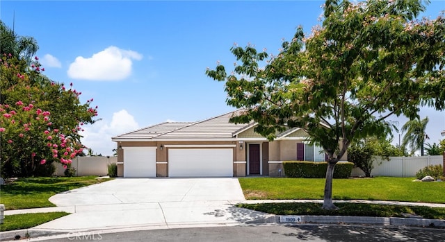 1909 Crystal Cove Ct, Redlands, CA 92374 - view of front of property featuring an attached garage, driveway, stucco siding, and a tiled roof