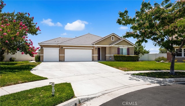 1909 Crystal Cove Ct, Redlands, CA 92374 - view of front facade featuring a garage, driveway, stucco siding, and a tile roof