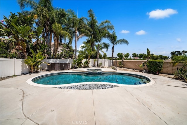 1909 Crystal Cove Ct, Redlands, CA 92374 - view of swimming pool with an in-ground hot tub, a fenced backyard, and a patio