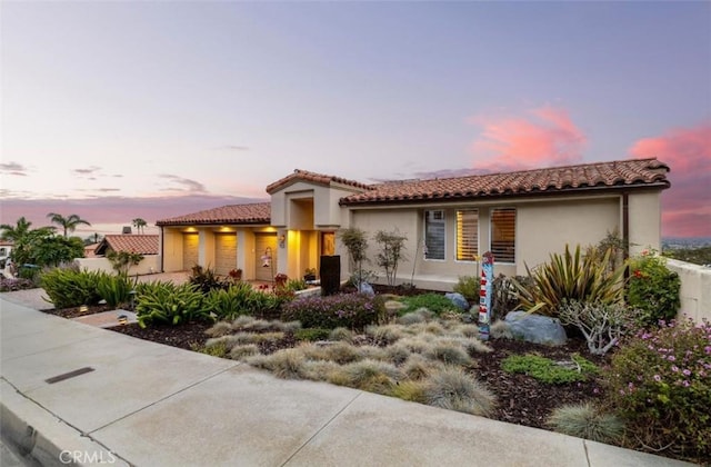 425 Via El Chico, Redondo Beach, CA 90277 - mediterranean / spanish-style house with stucco siding, a tile roof, and a garage