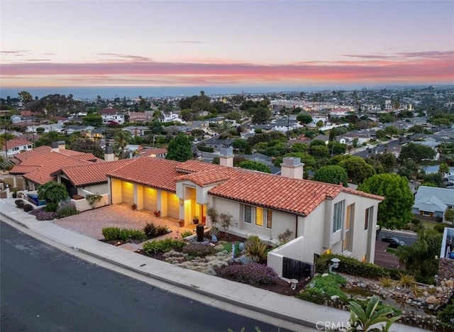 425 Via El Chico, Redondo Beach, CA 90277 - view of front of home with a tiled roof, a chimney, a garage, stucco siding, and driveway