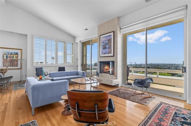 425 Via El Chico, Redondo Beach, CA 90277 - living area featuring a tiled fireplace, lofted ceiling, and wood finished floors
