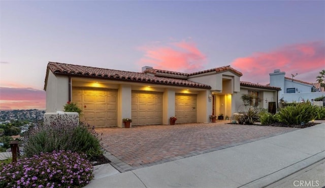425 Via El Chico, Redondo Beach, CA 90277 - mediterranean / spanish house featuring a garage, driveway, stucco siding, and a tiled roof