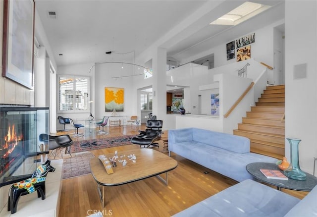 425 Via El Chico, Redondo Beach, CA 90277 - living room with a fireplace, wood finished floors, and stairs