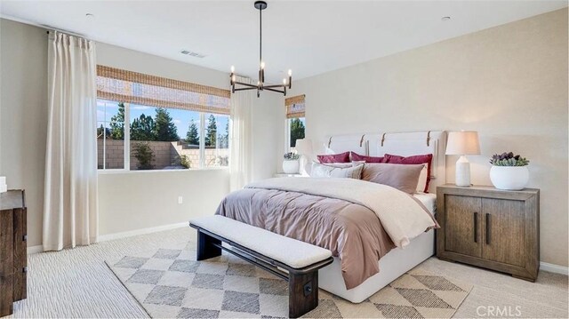 7599 Taylor Ave, Hesperia, CA 92345 - bedroom with light carpet and a chandelier