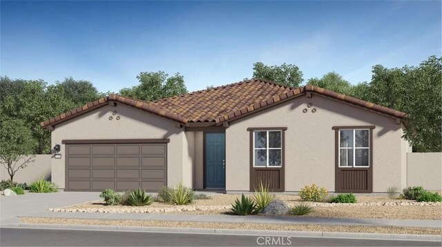 7599 Taylor Ave, Hesperia, CA 92345 - mediterranean / spanish-style home featuring a garage, stucco siding, concrete driveway, and a tile roof