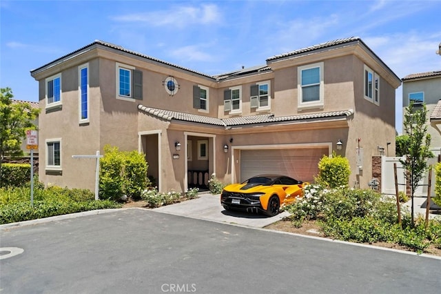 7524 Cessna St, Chino, CA 91708 - townhome / multi-family property with stucco siding, a tiled roof, a garage, and driveway