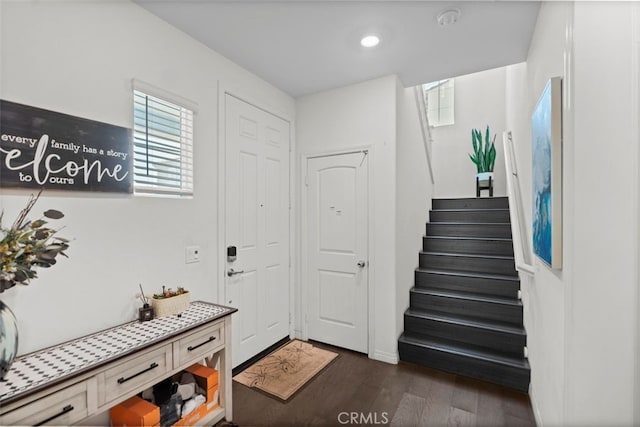 7524 Cessna St, Chino, CA 91708 - entrance foyer featuring stairs and dark wood-type flooring
