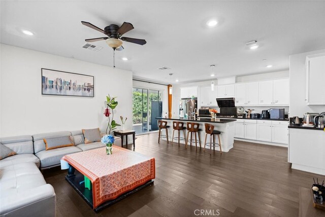 7524 Cessna St, Chino, CA 91708 - living room featuring ceiling fan, recessed lighting, and dark wood-type flooring