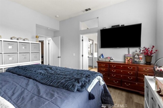 32110 Camino Herencia, Temecula, CA 92592 - bedroom featuring wood finished floors and ensuite bathroom
